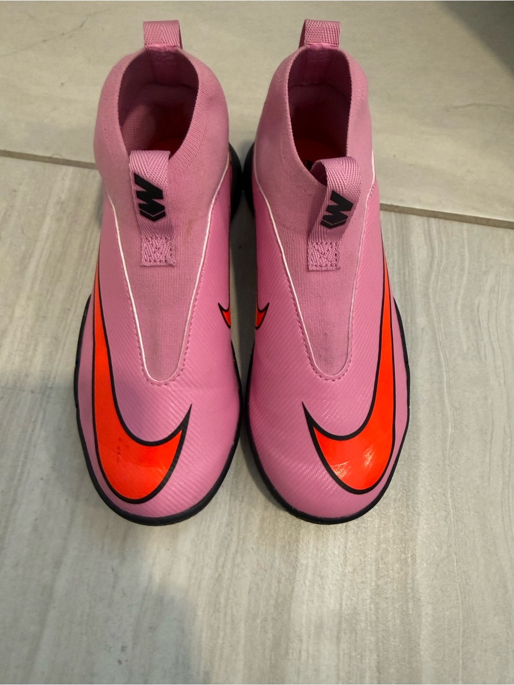 Nike kids indoor soccer shoes Pink Slip-On Trainers with Bright Orange Swoosh